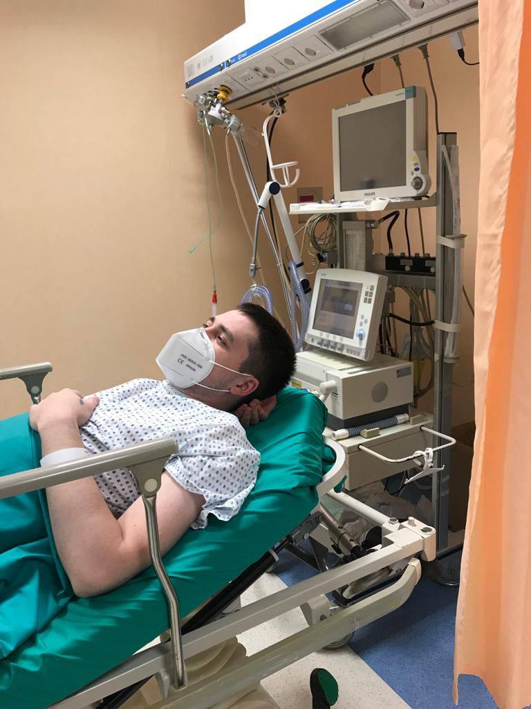 Igor in the hospital ward with medical equipment